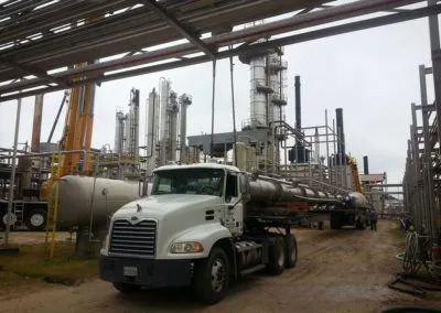 H. Brown, Inc. crane and specialized transportation service moving equipment into place to be lifted and set inside a silo.