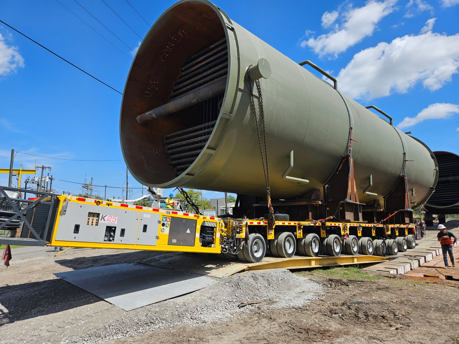 H. Brown, Inc. crane and heavy hauling service transporting and installing 150,000 lb. crystallizer from a barge utilizing SPMTs. 