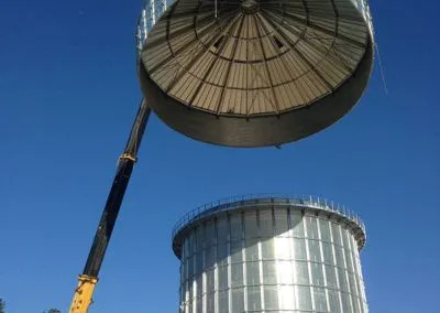 H. Brown, Inc. crane service installing the roof of a silo. 