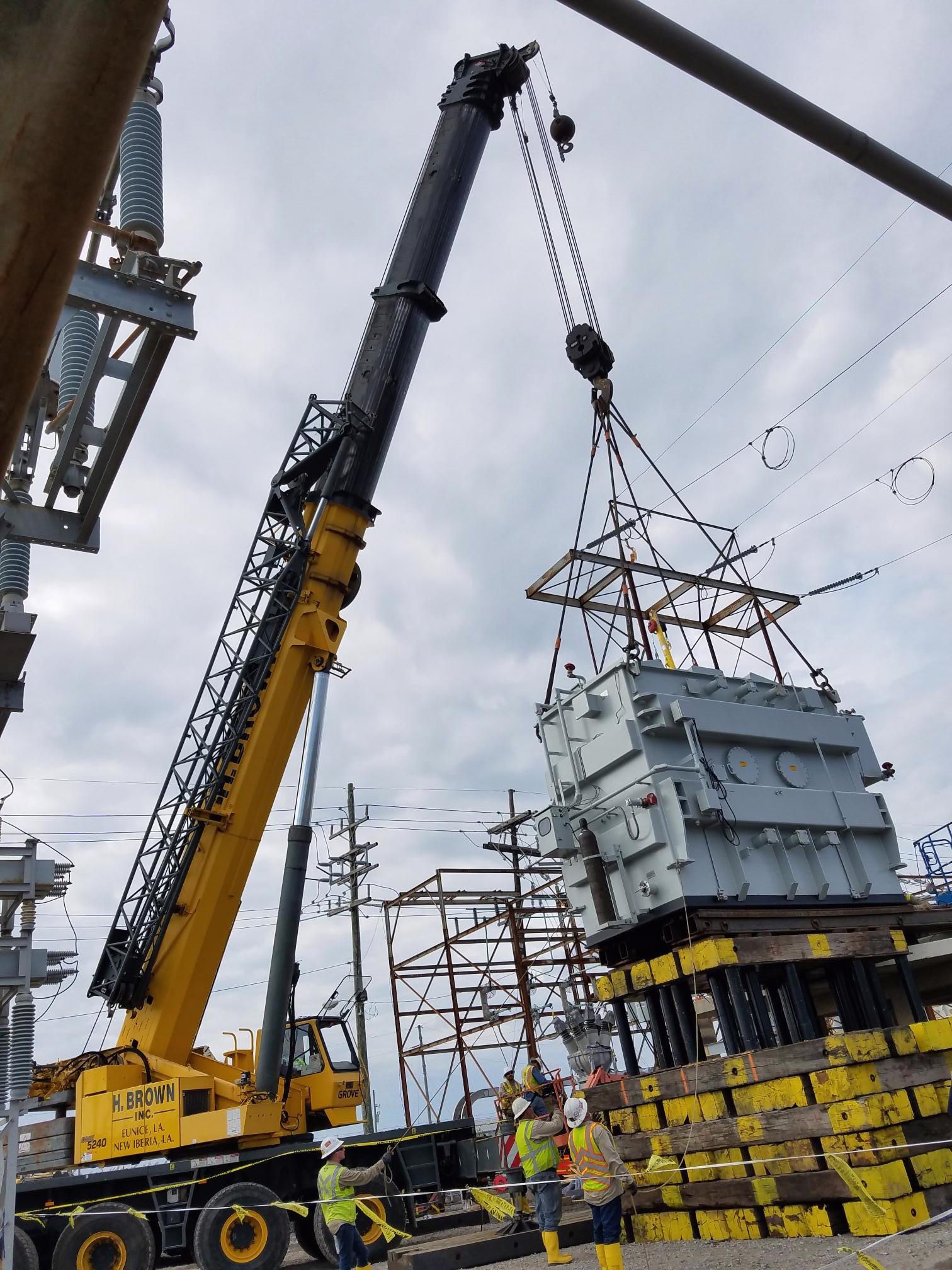 H. Brown, Inc. crane and rigging service jacking and sliding a transformer under power lines in order to perform a safe lift with a 240t crane in South Louisiana.