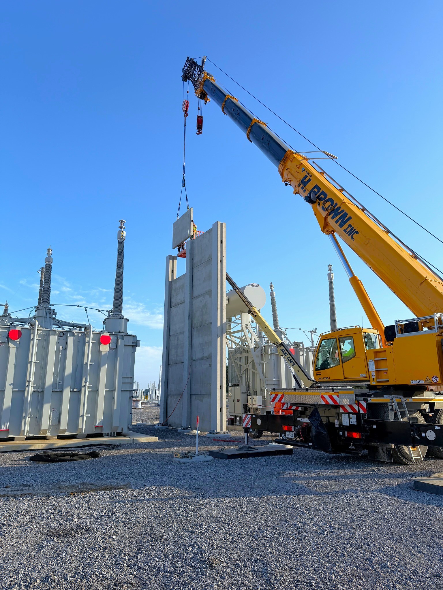 H. Brown, Inc. crane and rigging service installing blast walls in an electrical substation utilizing a 120t crane.