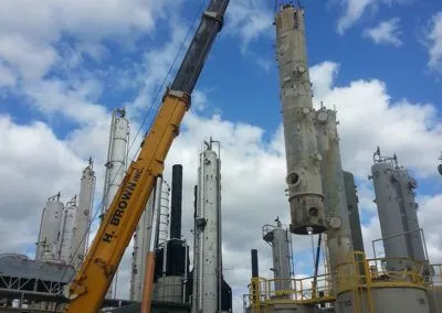 H. Brown, Inc. crane service mid lift and preparing to place processing equipment inside a silo.