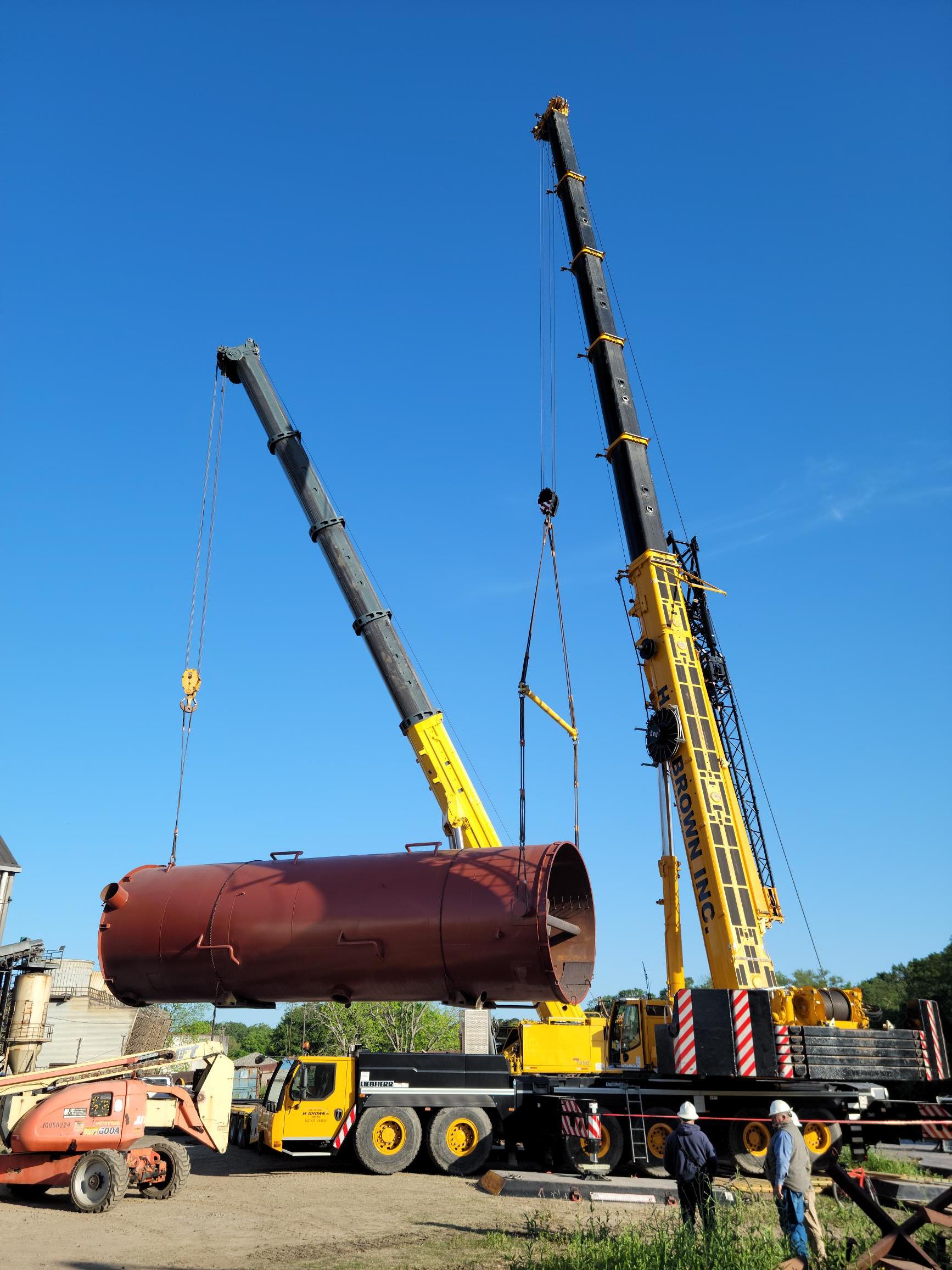 H. Brown, Inc. crane, rigging and heaving hauling service transporting a crystallizer off a barge and performing a dual crane lift to install.