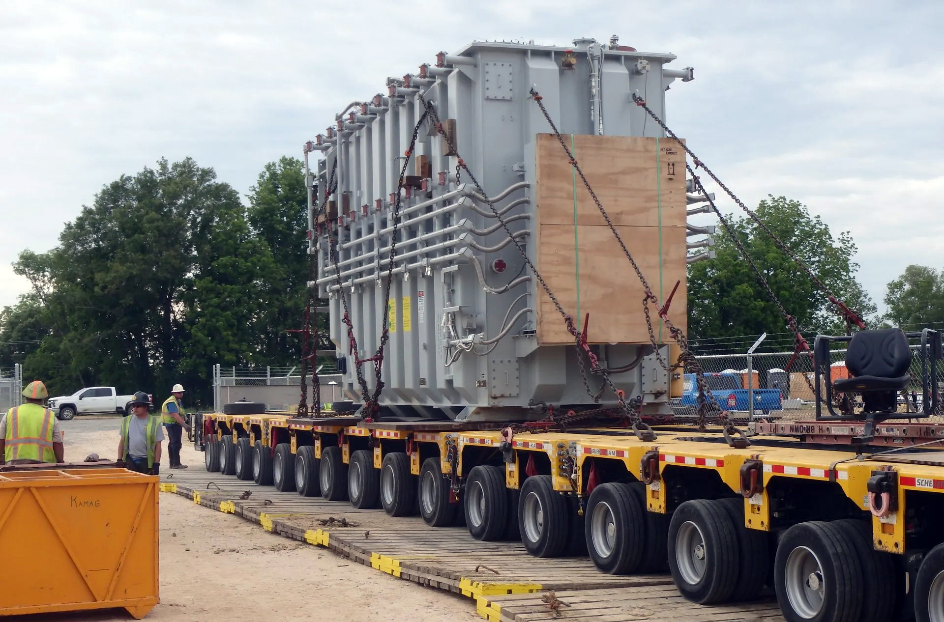 H. Brown, Inc. Rigging and specialized transportation service preparing to offload a transformer from SPMTs utilizing jacking and sliding. 